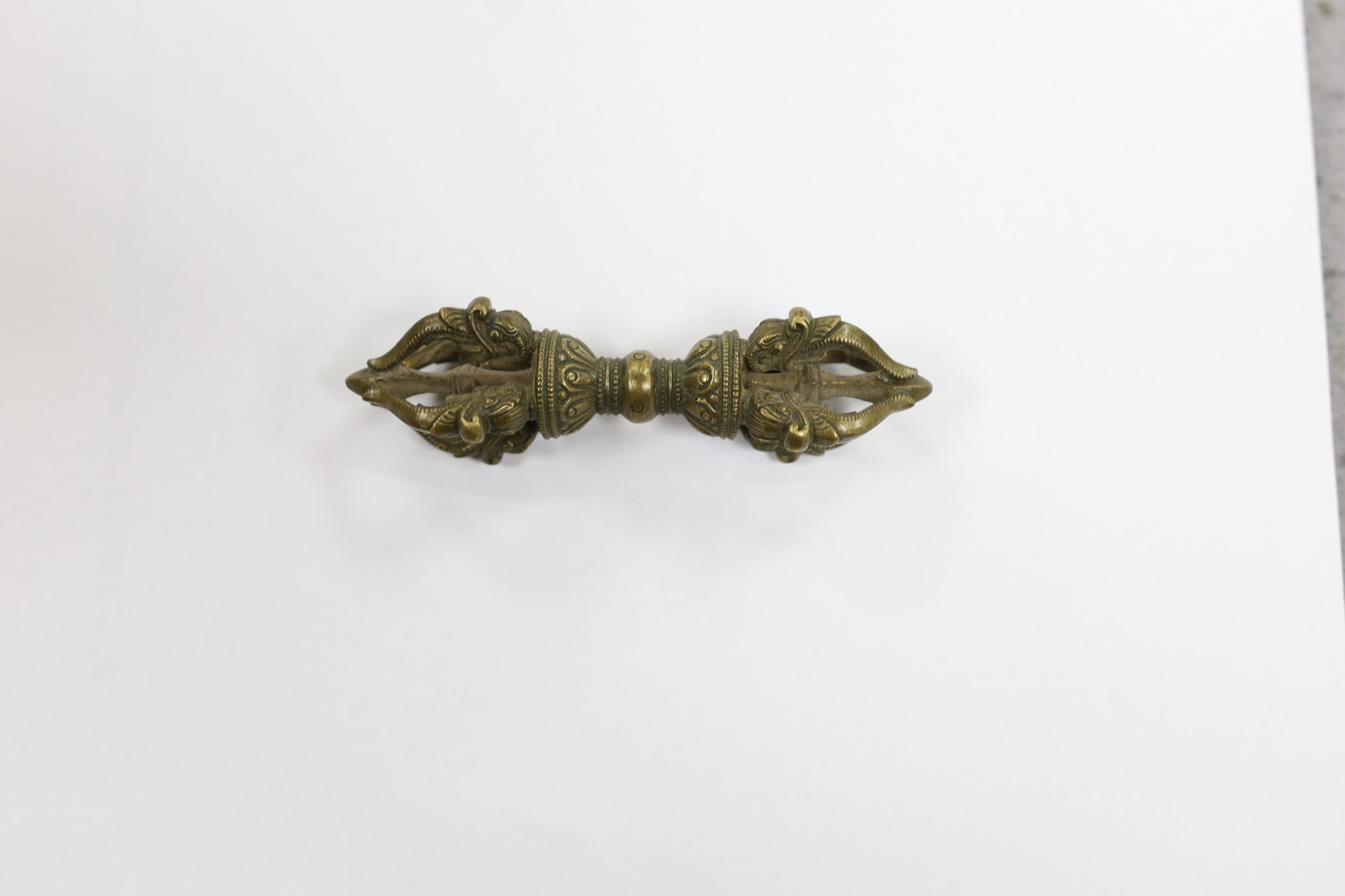 Five Chinese or Tibetan bronze figures or Buddhist implements, tallest 13cms high